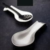 Pack of 2 heat-resistant silicone spoon rests for kitchen utensils, non-slip cooking tool organizers for countertops.