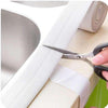 Self-adhesive waterproof sealant tape for kitchen sink and bathroom corner sealing, easy to cut and apply.