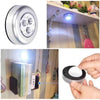 Mini LED battery-powered wireless stick-on tap touch lamp for under-cabinet, wall, kitchen, and closet lighting.