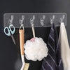 6 hooks transparent strong self-adhesive wall rack for bathroom and kitchen organizing towels, loofahs, and utensils.