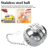Stainless steel tea infuser ball with mesh filter, chain, and hook for loose leaf tea and kitchen spices.