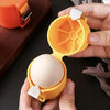 Egg Opener and Shell Separator for quick peeling, easy-clean plastic kitchen tool with secure lid for baking.