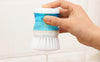 Plastic pot dish brush with liquid soap detergent storage for easy kitchen cleaning and dishwashing.