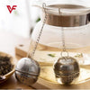 Stainless steel tea infuser mesh filter ball with hanging hook for loose leaf tea and kitchen spice seasoning.