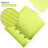 Heat-resistant silicone kitchen utensil spoon rest with drip pad and non-slip slots for spatulas, forks, and tongs.