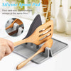 Heat-resistant silicone kitchen utensil spoon rest with drip pad and 4-slot rack for spatulas and cooking tools.