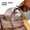 Professional stainless steel pizza cutter wheel with sharp blade slicing brownies on a wooden cutting board.