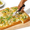 Professional stainless steel pizza cutter wheel slicing a fresh pizza on a wooden board. Easy to clean kitchen gadget.