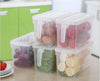 Pack of 3 plastic fridge organizer storage bins with lids and handles for fresh produce, fruits, and vegetables.