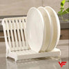 Small plastic foldable dish drying rack organizer for kitchen sink, perfect for draining bowls and plates efficiently.