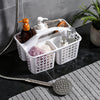 Portable white plastic shower caddy basket with compartments for organizing toiletries in bathroom or kitchen sink.