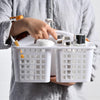 Portable white plastic bathroom shower caddy basket with handle and compartments for organizing toiletries and cleaning.