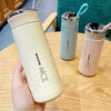 NICE Water Bottle, portable stainless steel vacuum flask set in pastel beige, blue, and pink with carry straps.