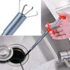 Sink Drain Clog Wire grabber tool with flexible metal cable for removing hair and blockages from bathroom sinks.