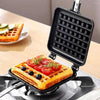 Non Stick Waffle Maker cooking a savory waffle topped with fresh tomatoes and blueberries on a gas stovetop.