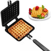 Non Stick Waffle Maker for stovetop with a freshly cooked golden brown waffle and strawberries on a side plate.