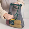 Net Basket for Vegetable with mesh design for kitchen storage, reusable grocery bag holding fresh corn, grey color.