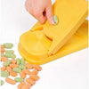 Manual plastic dumpling mold creating textured gnocchi pasta shapes on a kitchen surface.