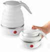 Folding electric kettle for travel, showing both expanded and collapsed positions for compact, portable storage.