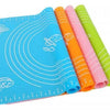 Silicone baking mat set for rolling dough, featuring non-stick surface and measurement guides for precision baking.