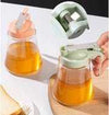 Glass honey bottle with auto-flip lid, leak-proof kitchen dispenser for syrup, oil, or honey, easy-pour design.