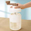 Ice Crusher White manual hand-crank machine for making shaved ice and cocktails with a clear storage container.