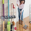 5 in 1 Mop Holder wall-mounted organizer for mops, brooms, and cleaning supplies for home organization.