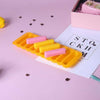 Ice-Line Silicone Tray: yellow narrow strip ice mold for water bottles with pink and yellow ice sticks.