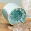 Mini silicone ice bucket and 2-in-1 ice cube maker with ice storage box spilling cubes on a wooden table.
