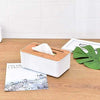 Wooden tissue box cover, a rectangular handcrafted facial tissue holder with a white base and bamboo wood top.