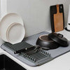 Ultra-Absorbent Dish Drying Mat: Large microfiber kitchen drainer pad with rack holding plates, pans, and cutlery.