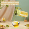 2-in-1 Oil Spray & Pour Jug, anti-drip glass oil dispenser with one-touch opening for easy kitchen cooking.
