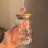 Premium 500ml aesthetic ribbed glass cup with pink bow, bamboo lid, and straw. Stylish iced coffee drinking glass.