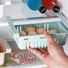 Stretchable Fridge Organizer Basket, adjustable space-saving storage box holding eggs on a refrigerator shelf.