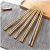 Pack of 10 pairs reusable bamboo chopsticks with non-slip texture for sushi, dining, and kitchen use.