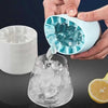 Mini Silicone Ice Bucket, 2-in-1 ice cube maker and storage box pouring fresh ice cubes into a glass.