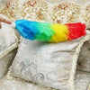 Rainbow Microfiber Duster cleaning dust from a decorative cushion for home and car maintenance.