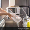 Cleaning a Meat Storage Container fresh-keeping box with removable drain plate under kitchen faucet water.