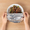 10 Pcs Foil Insulation Food Cover Set used as a thermal keep-warm umbrella tent to protect hot meals on a dinner plate.