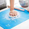 Rotimatt non-stick silicone mat for kneading dough, rolling rotis, and baking with measurement markings on blue surface.