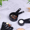 10-piece black plastic measuring cups and spoons set for professional baking, featuring precise cooking measurements.