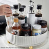 360° rotating spice rack organizer with jars on a white multi-functional Lazy Susan for kitchen countertop storage.