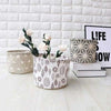 Round organizing baskets with botanical and heart patterns, premium multipurpose storage bins for home organization.