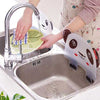 Panda kitchen sink splash guard, a water splash-proof silicone barrier suctioned to a stainless steel kitchen sink.