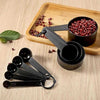 10-piece measuring cups and spoons set, professional plastic baking kit with black measuring tools on a wooden tray.