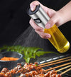 100ml oil spray bottle, stainless steel and glass olive oil mister, spraying oil over grilling BBQ meat skewers.