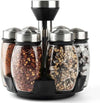 Rotating spice rack organizer with 6 glass jars and stainless steel lids for modern kitchen spice storage.