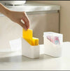 Stackable fridge organizer bin with lid, clear plastic storage for cheese slices and snack packets on kitchen counter.