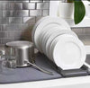 Dish drying mat with rack and super absorbent grey kitchen draining pad holding plates and cookware on a counter.