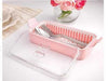 Pink cutlery holder with lid, dust-proof spoon and fork organizer featuring a built-in strainer for kitchen storage.